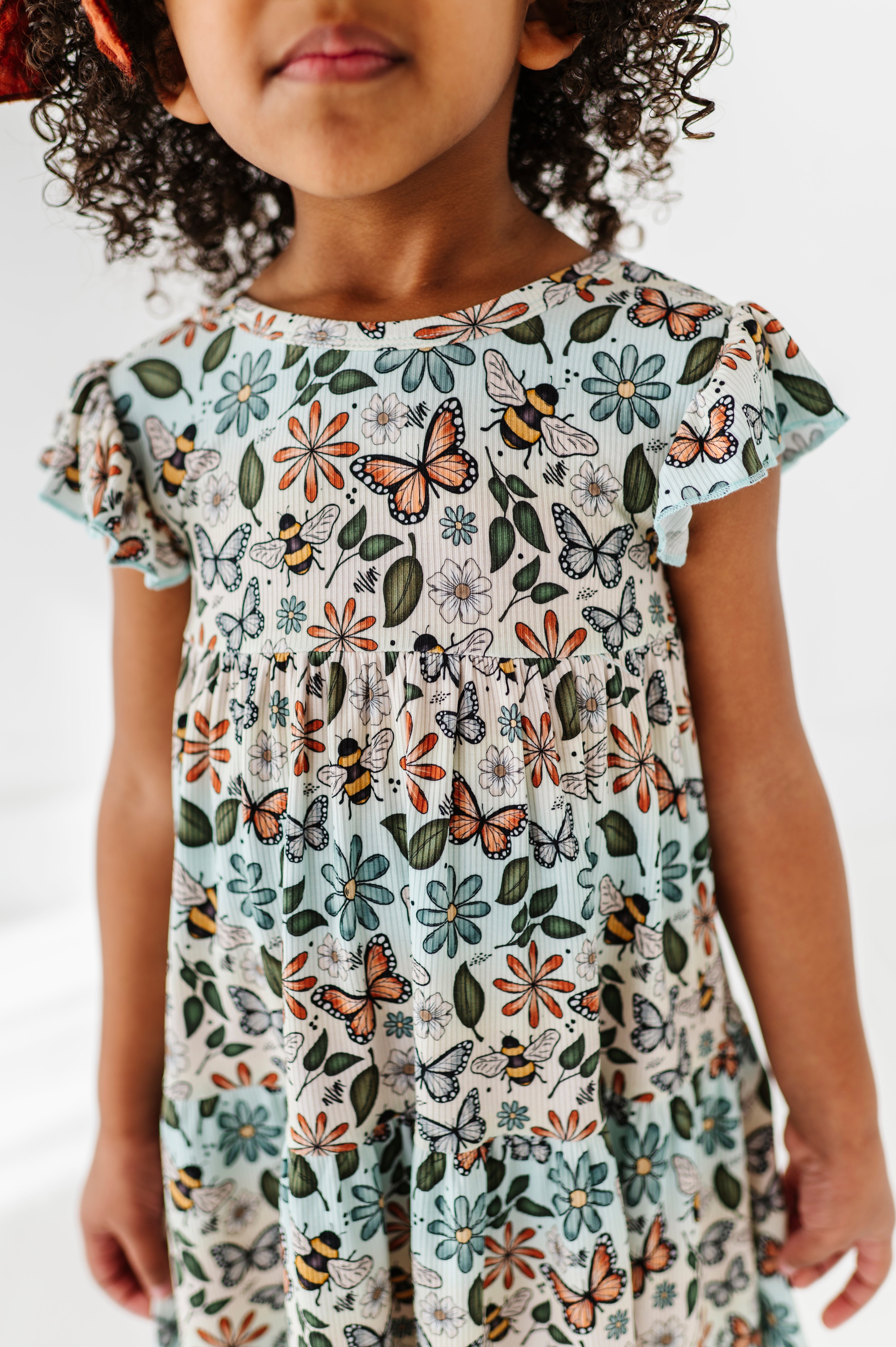 RIBBED TIERED FLUTTER SLEEVE TWIRL WITH SHORTS - BUZZING BLOSSOMS