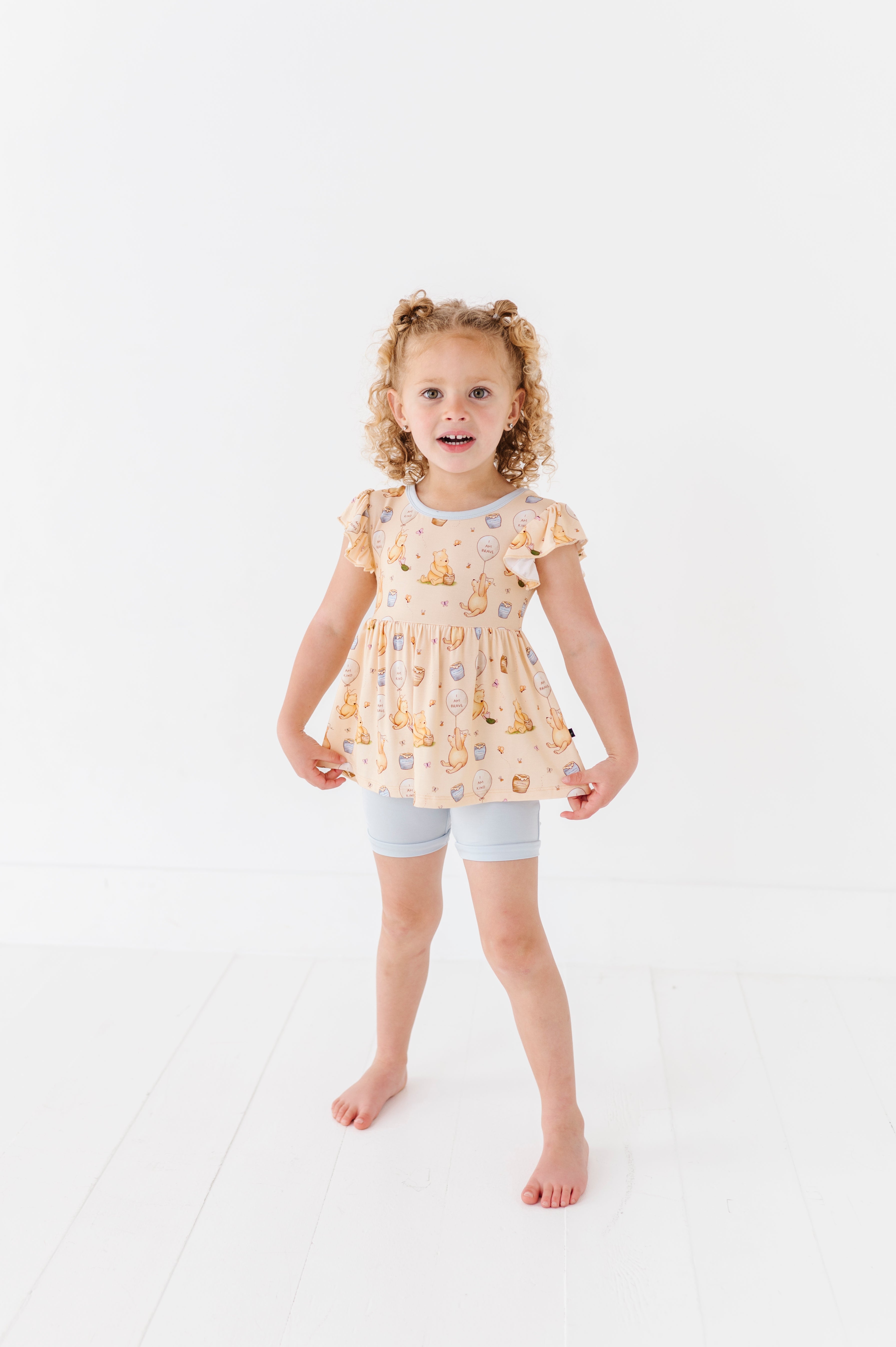 FLUTTER PEPLUM WITH SHORTS - 100 ACRES OF KINDNESS
