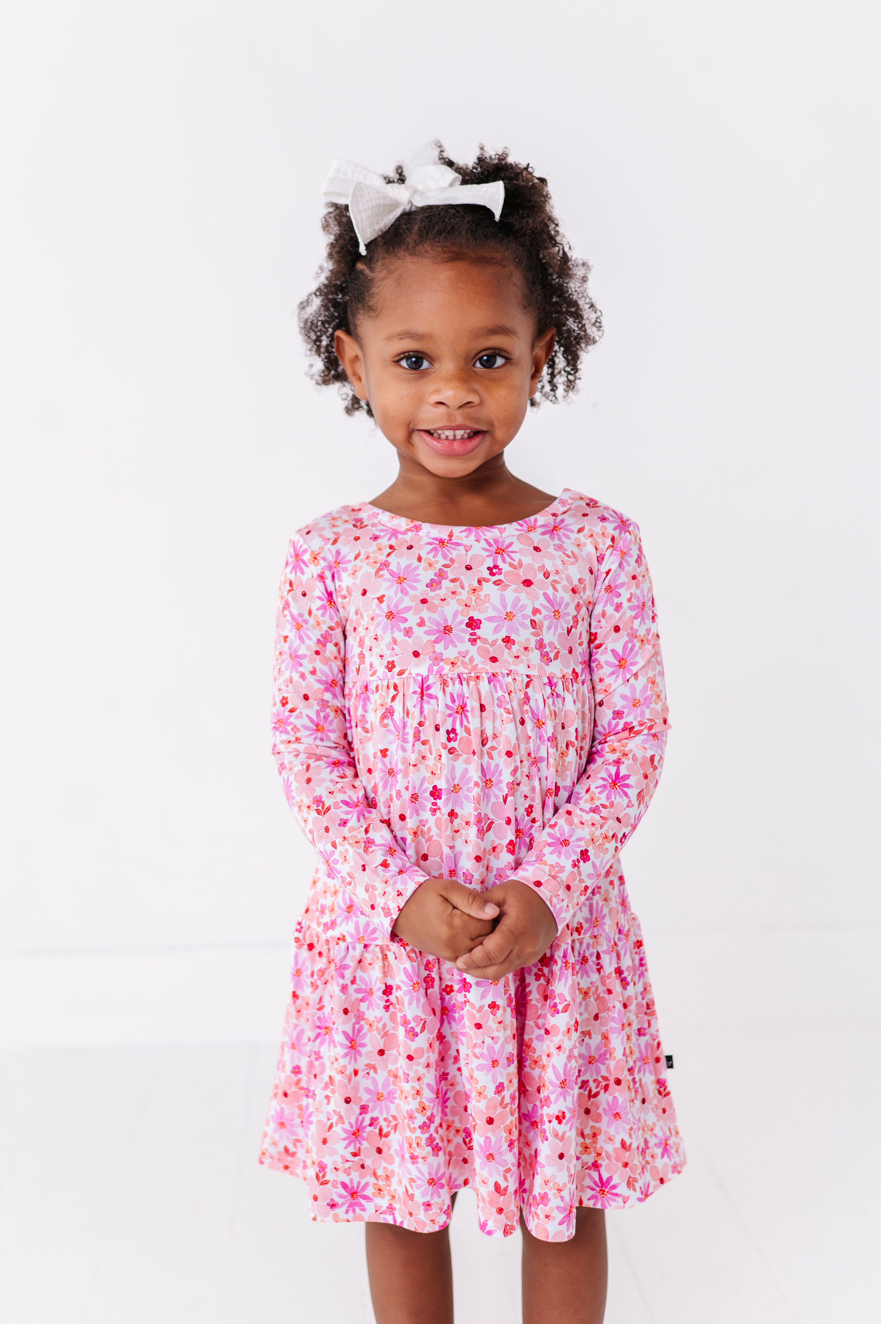 TIERED LONG SLEEVE TWIRL DRESS - BLUSHING BLOOMS