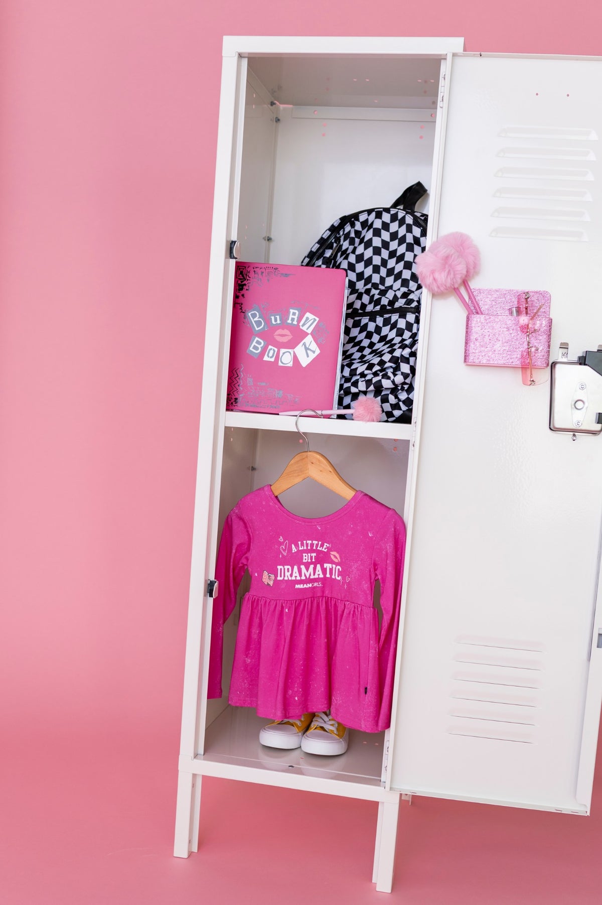 Mean Girls A Little Bit Dramatic dress in a white locker with a Burn Book