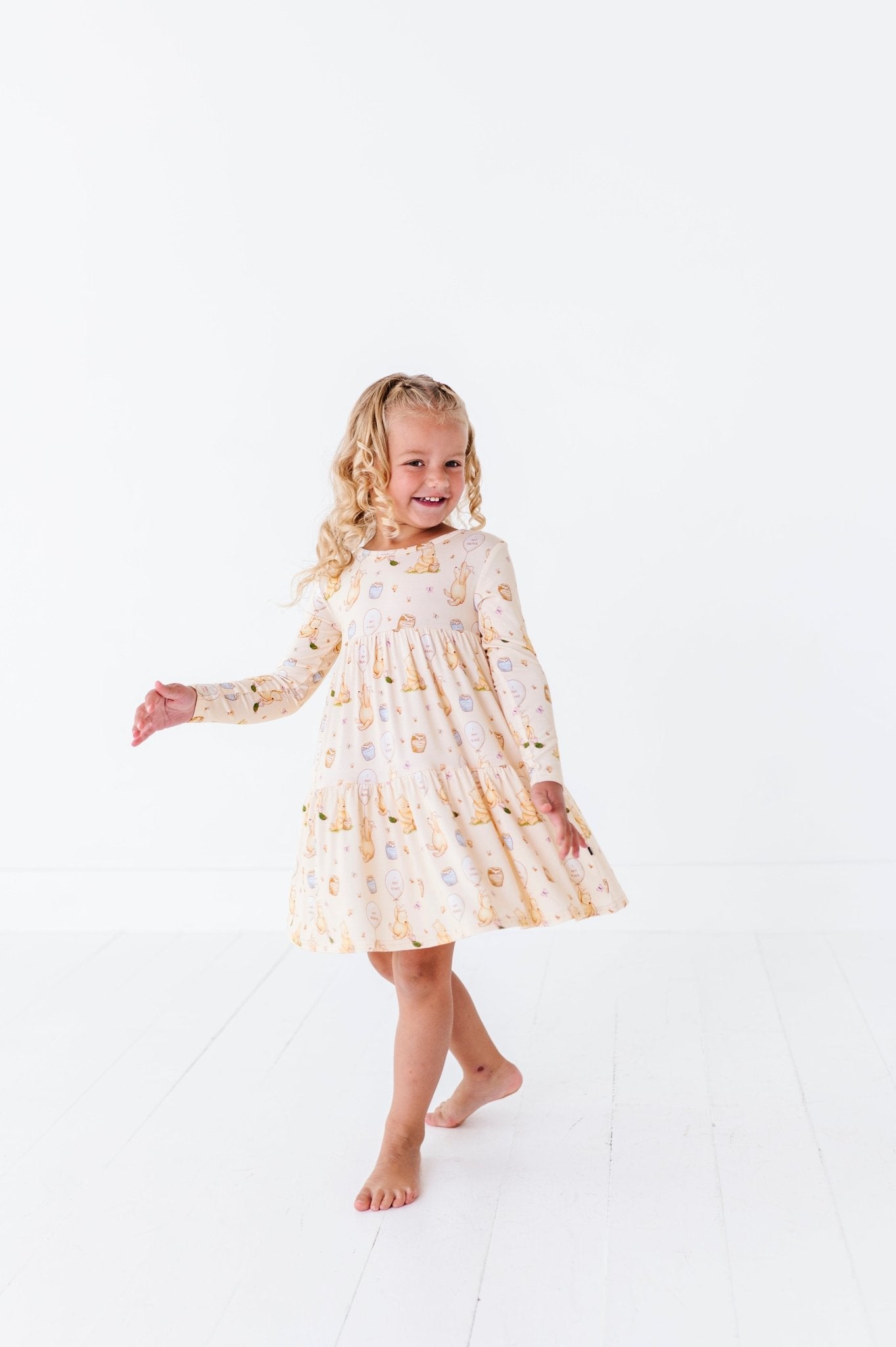 TIERED LONG SLEEVE TWIRLIE DRESS - 100 ACRES OF KINDNESS - The Sleepy Sloth